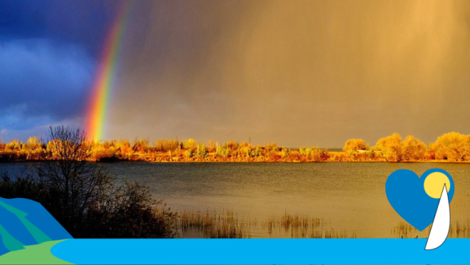 vivid rainbow over water with Town of Collingwood graphics and a blue heart along the bottom