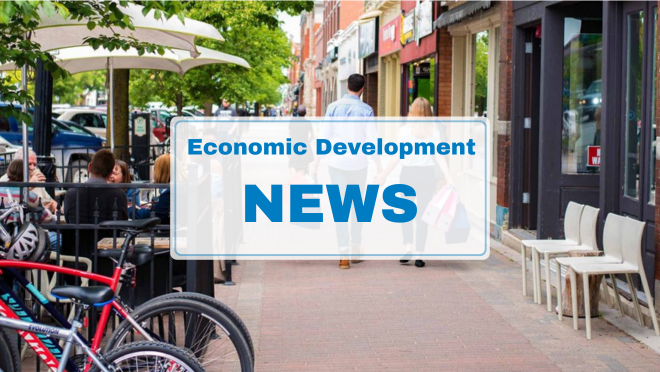 Couple walking down Hurontario Street with shopping bags. Text: Economic Development News