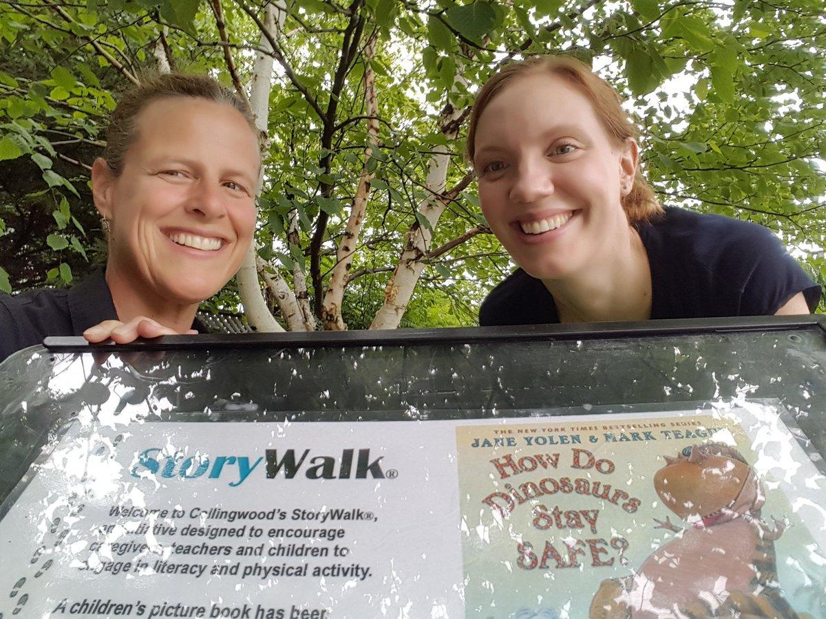 Picture infront of storywalk along the train trail